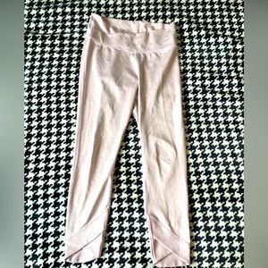 Nike light pink athletic leggings size large.